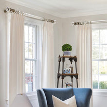 A handsome combination of beautiful glass finials and premium brass metal for the finest of homes. The collection offers acrylic poles that are not only stylish, but extremely thick and durable. The look is clean, crisp and contemporary. This hand-drawn hardware system maneuvers pleated drapery creations by baton.