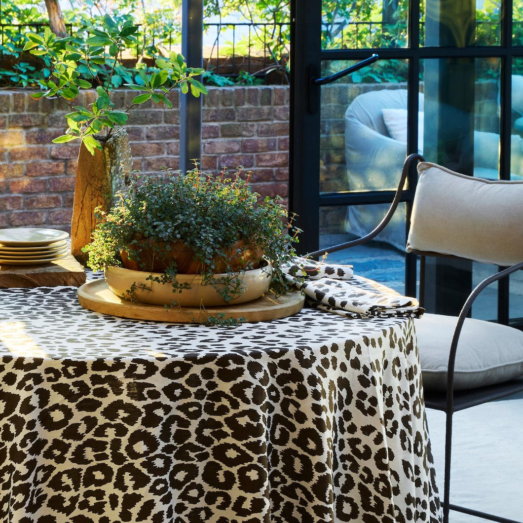 Schumacher Iconic Leopard custom tablecloth, printed on Matouk's classic linen in a daring brown for a table collection that's fit for casual gatherings and formal dinners alike. Our stunning collection of custom made tablecloths, available in assorted sizes