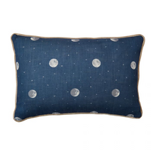 This denim blue Over the Moon Kit Kemp for Andrew Martin decorative pillow measures 16"H x 24"L. Features painterly moons and speckled stars acting as polka dots. Detailed with contrasting stone velvet piping. The cover is handmade in the UK and includes a feather insert made in the USA.