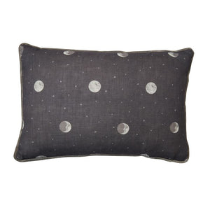 This denim grey Over the Moon Kit Kemp for Andrew Martin decorative pillow measures 16"H x 24"L. Features painterly moons and speckled stars acting as polka dots. Detailed with contrasting grey velvet piping. The cover is handmade in the UK and includes a feather insert made in the USA.