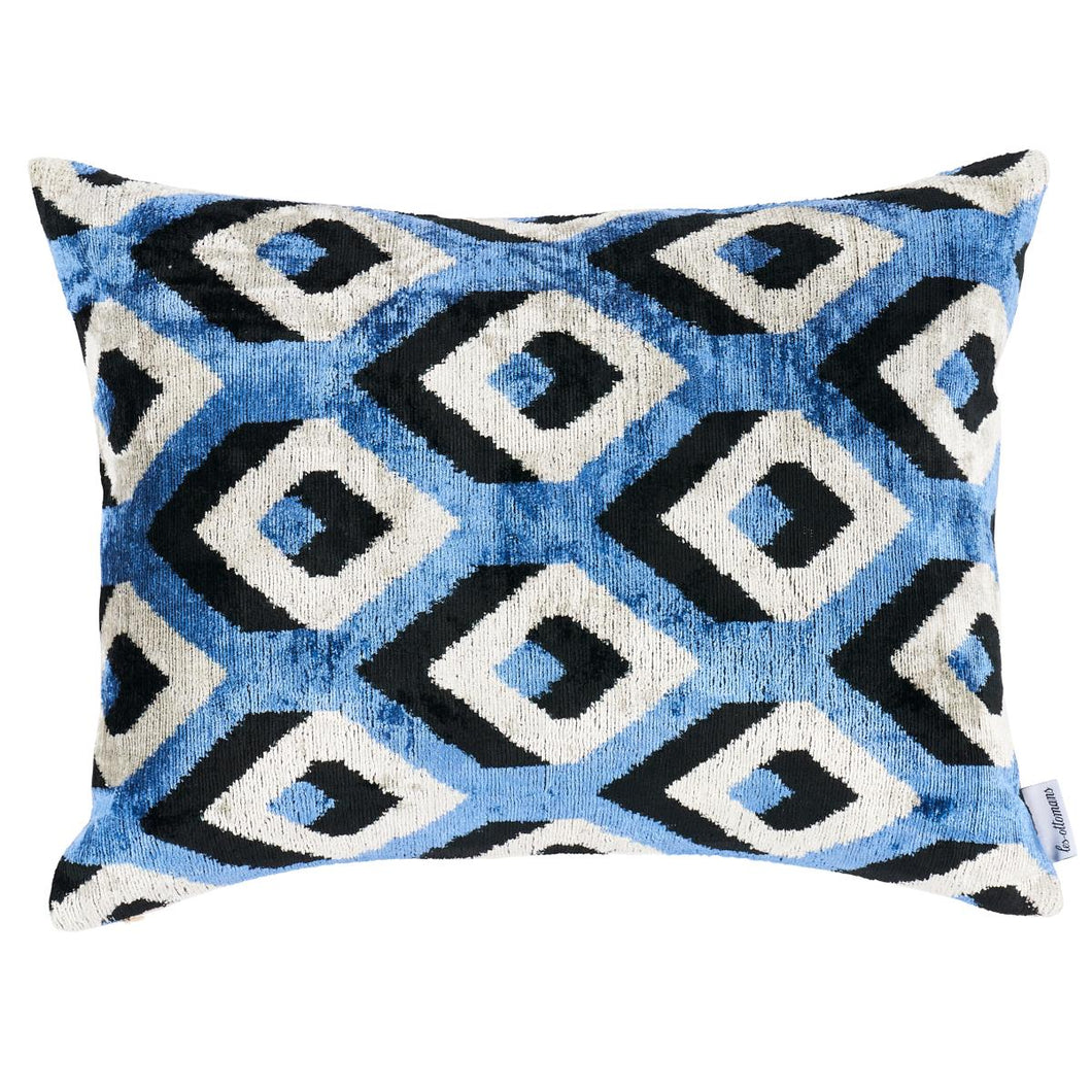 Schumacher Mersin silk velvet black & blue fabric pillows. The Mersin Silk Velvet Pillow by Les Ottomans features handwoven fabric with a knife edge finish. Les Ottomans pillows are handmade in Istanbul, juxtaposing the traditional patterns of Turkey with a wide range of contemporary colors, designs and textures. Each pillow features a silk velvet front with a solid cotton back, and includes a feather/down fill insert with hidden zipper closure.